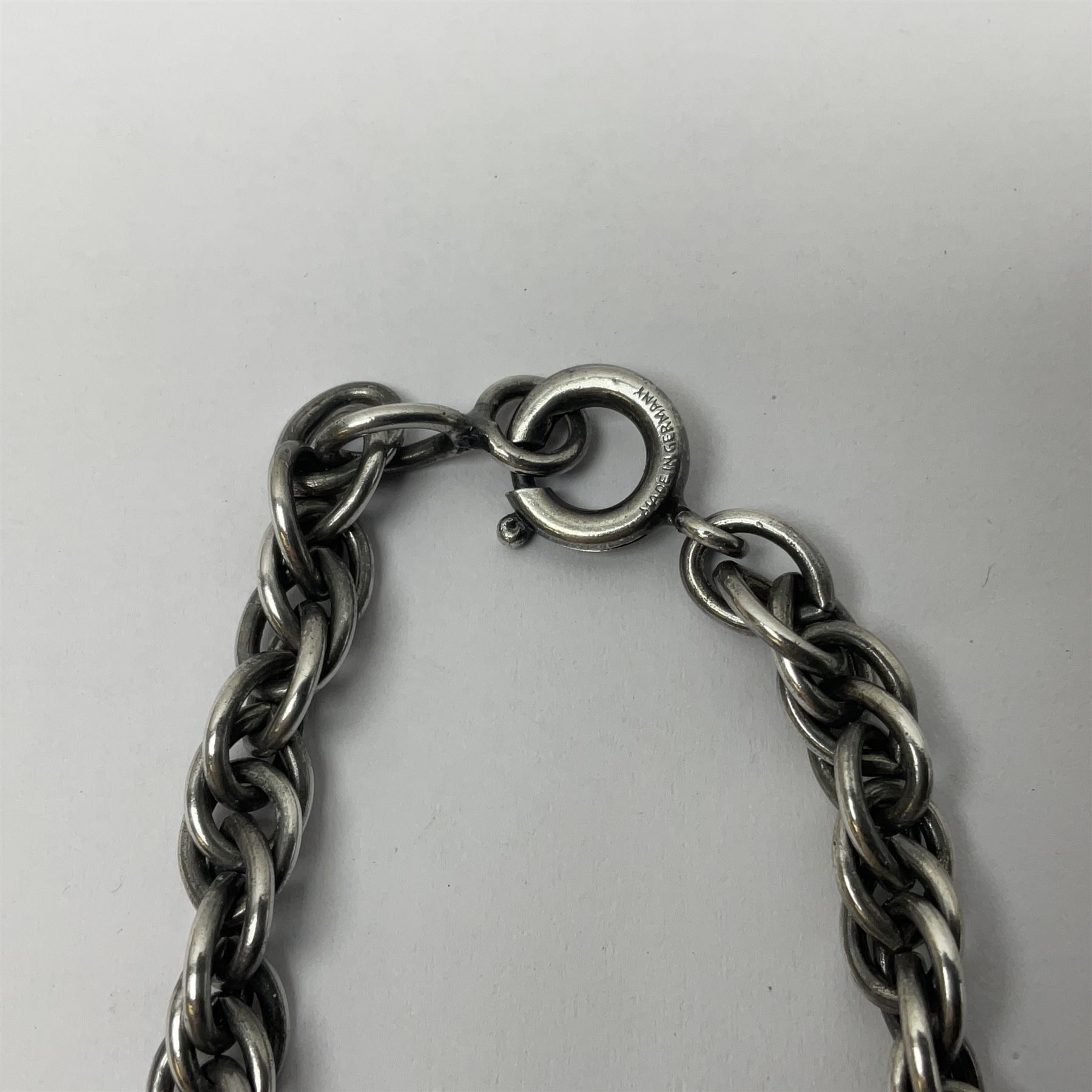 Joseff of Hollywood, circa 1950s metal and white paste necklace, with three graduated pendant drops set with white paste, to a Prince of Wales chain, signed with round script tag