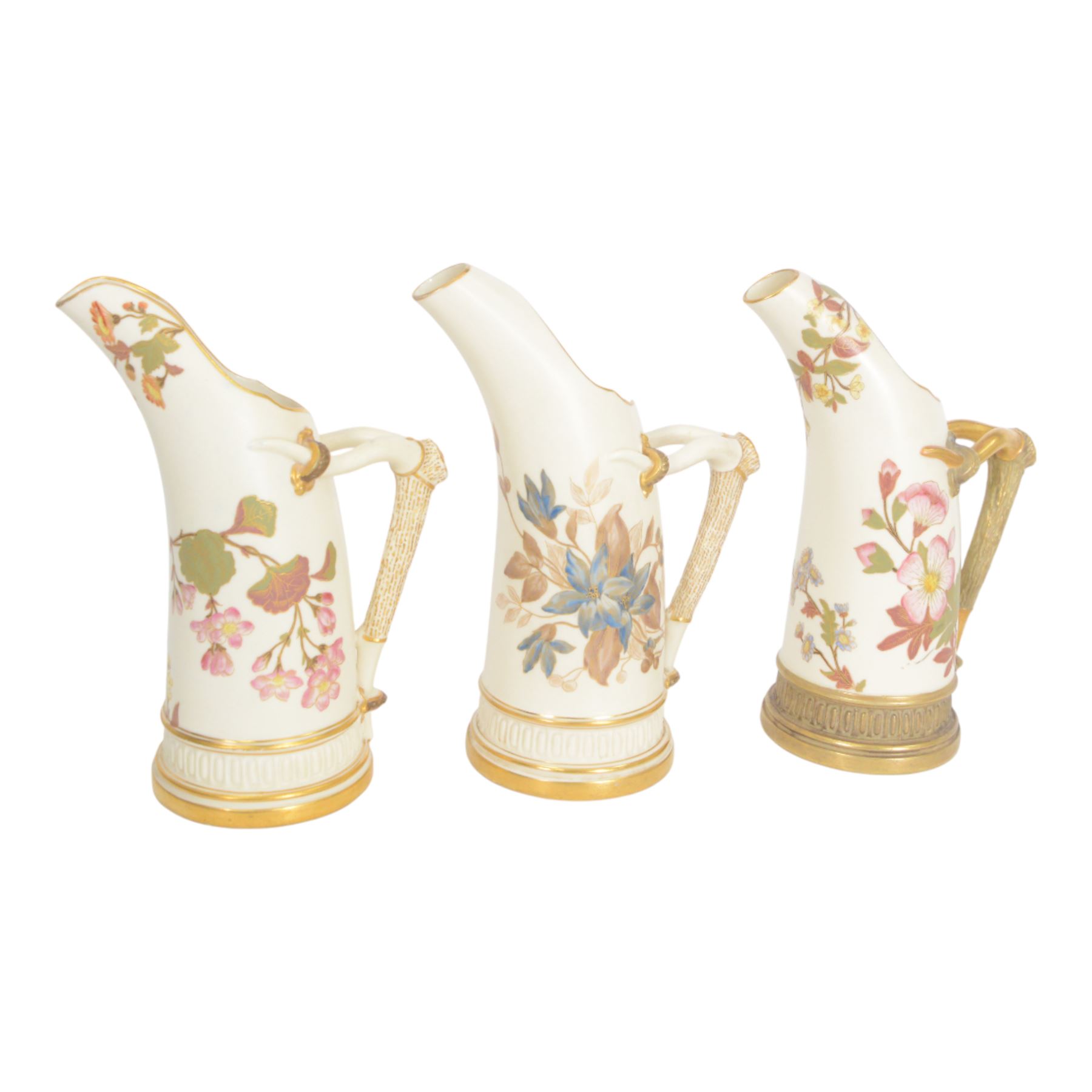 Four Royal Worcester tusk jugs of curved cylindrical form, the handle in the form of a gilded deer's antler, all decorated with floral sprigs, with puce marks beneath and numbered 1116, largest H29cm