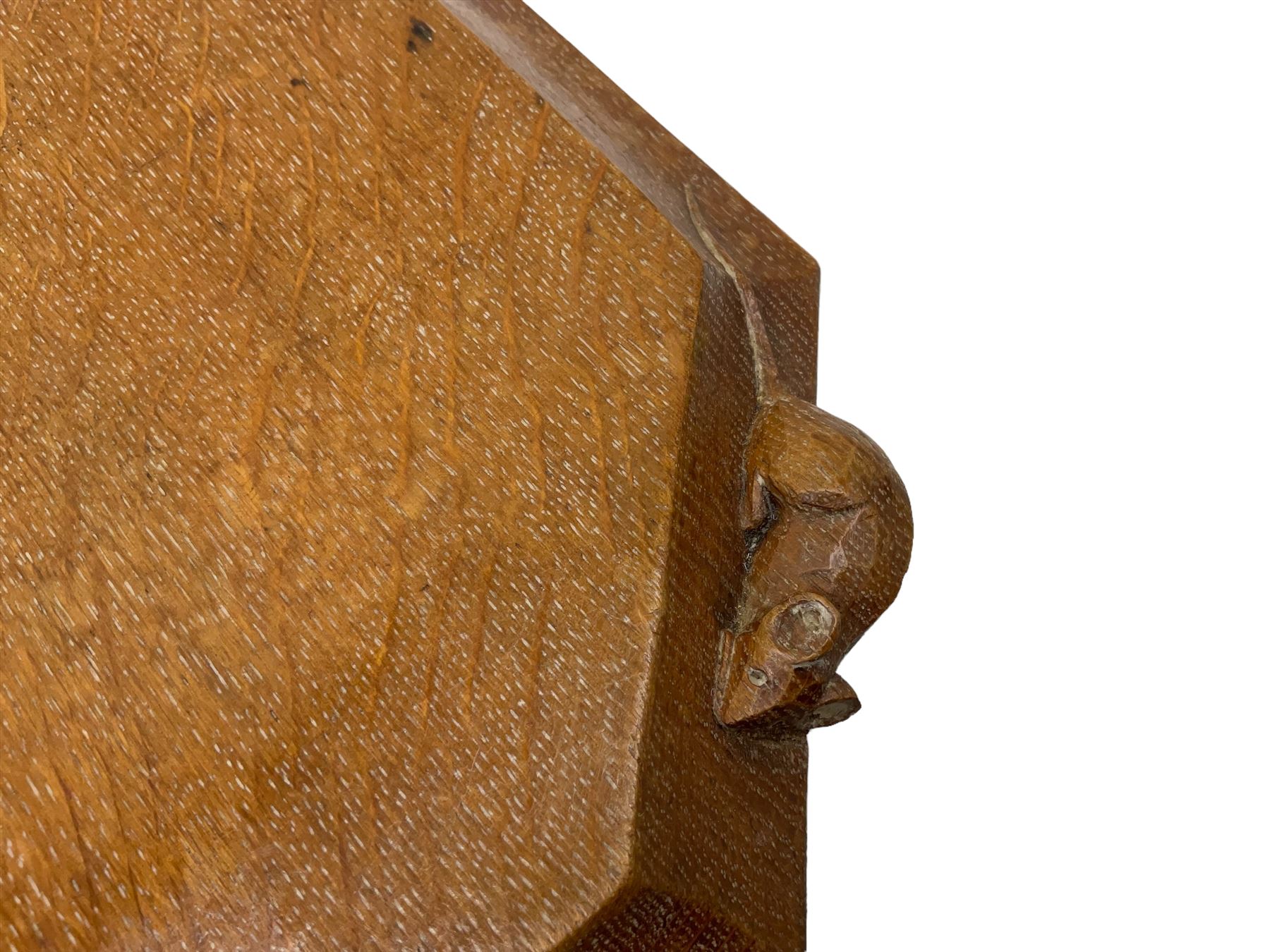 Mouseman - adzed oak breadboard, canted rectangular form with moulded edge carved with mouse signature, by the workshop of Robert Thompson, Kilburn, W31cm D26cm