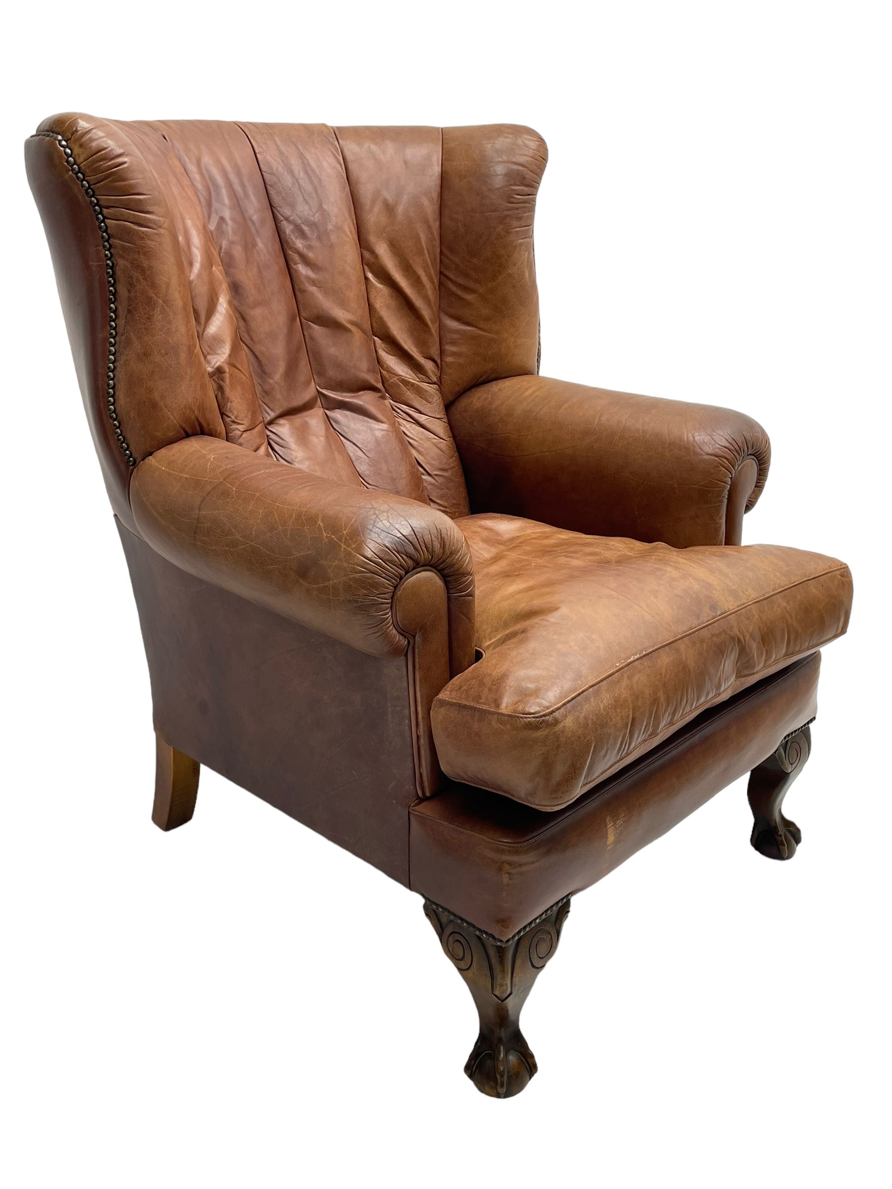 Tetrad - 'Blake' club armchair, fanned wingback and rolled arms upholstered in tan brown leather, on ball and claw carved cabriole feet 