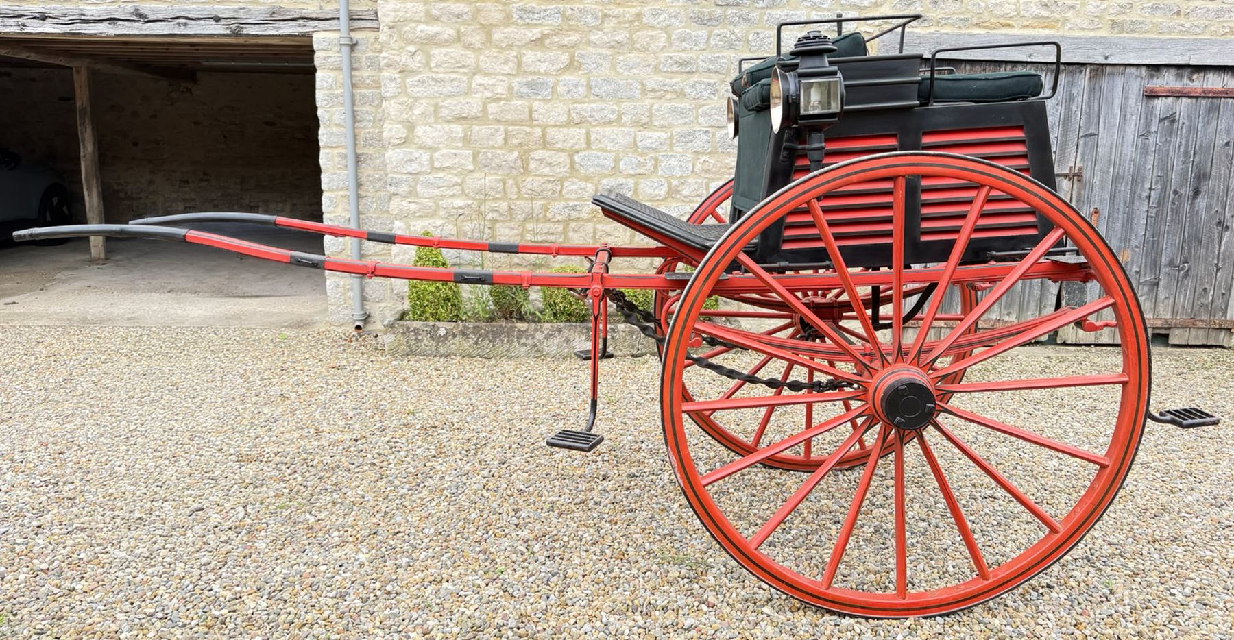 Holland & Holland Tandem Cart - Althorp Spencer Family Estate

A two wheeled tandem cart or cocking cart by Holland & Holland Coach Builders, London, with black painted bodywork, red painted shafts and running gear, red wooden spoked wheels with rubber tyres, green upholstered seating and a rear perforated metal footboard. The cart is fitted with carriage lamp brackets (lamps next lot), green buttoned cushions with leather retaining straps, side louvered body panels, footrests, leaf spring suspension and shafts for horse use. The carriage incorporates an adjustable body position, operated by a lever, allowing the body to be moved forwards or backwards to alter the weight distribution. Formerly owned by the family of Lady Diana Spencer,
Sympathetically conserved by Woods of Fairbourne Carriages Ltd, Kent.

Features:
• Brass maker’s plaque for Holland & Holland Coach Builders, London
• Two wheeled tandem cart
• Black painted body with red painted shafts and running gear
• Red wooden spoked wheels with rubber tyres
• Green upholstered cushions with leather retaining straps
• Adjustable carriage body for weight distribution
• Lever operated adjustment mechanism
• Perforated rear footboard
• Side footrests
• Louvered side panels
• Leaf spring suspension
• Rear opening storage compartment
• Decorative painted armorial motif to rear panel
• Fitted carriage lamps shown, not included in the lot (available as next lot)
• Conserved by Fairbourne Carriages Ltd
• Provenance: The Althorp Attic Sale including The Spencer Carriages, lot 195, 7 July 2010

Dimensions:
Overall length 396 / 198cm
Width 155cm
Height 190cm

Wheel Diameters:
Wheels: 148cm

Seating:
Driving seats: 2
Passenger seats: 2