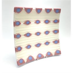 Zdenek Lhotsky glass platter, decorated with geometric motifs in pink and blue upon a white ground, L26cm, with certificate and box.