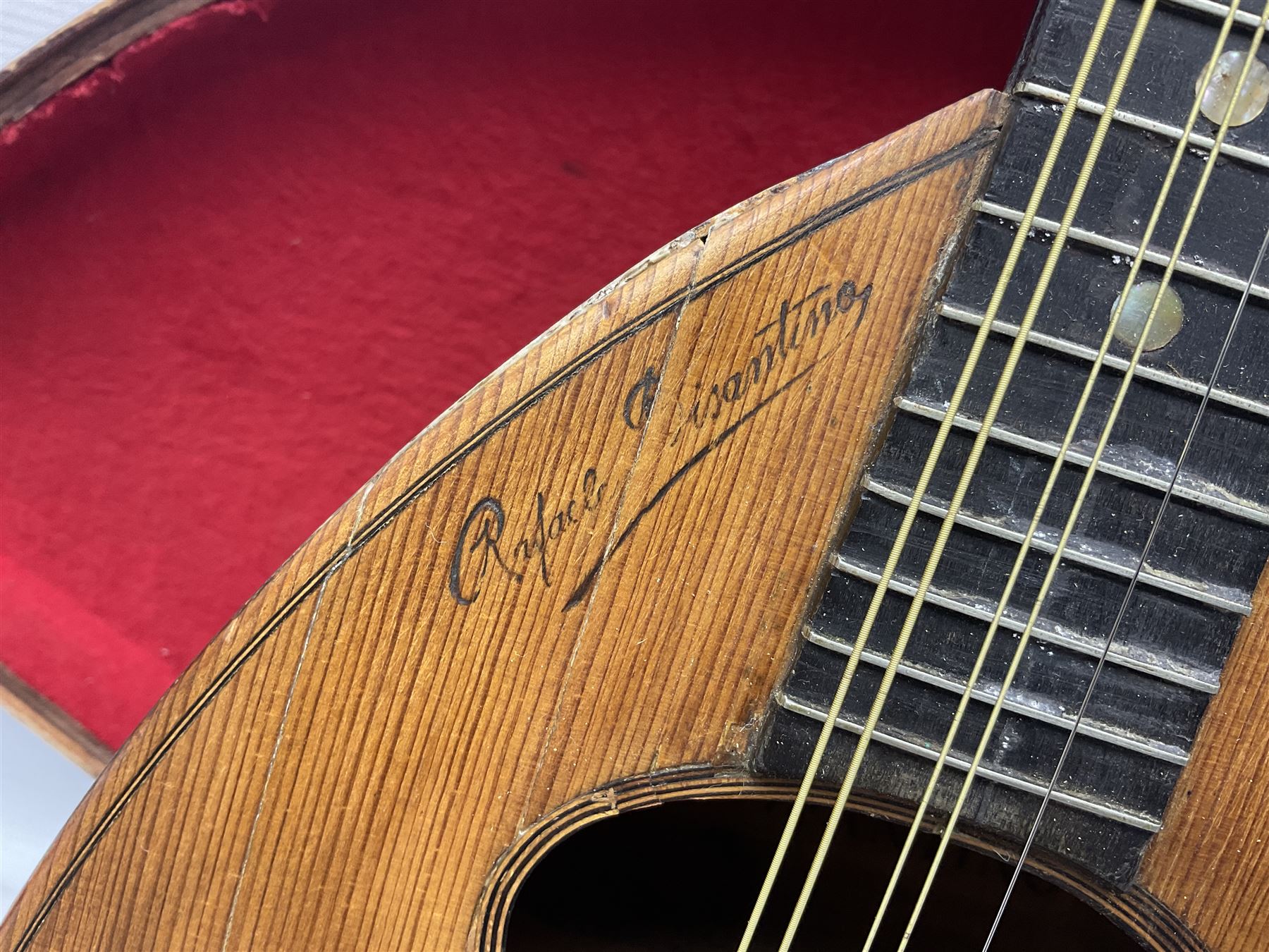 Early 20th century Italian Rafaele Disantino eight-string mandolin with two-piece back and spruce top with stamped Rafaele Disantino signature; bears maker's label L61cm; in wooden carrying case