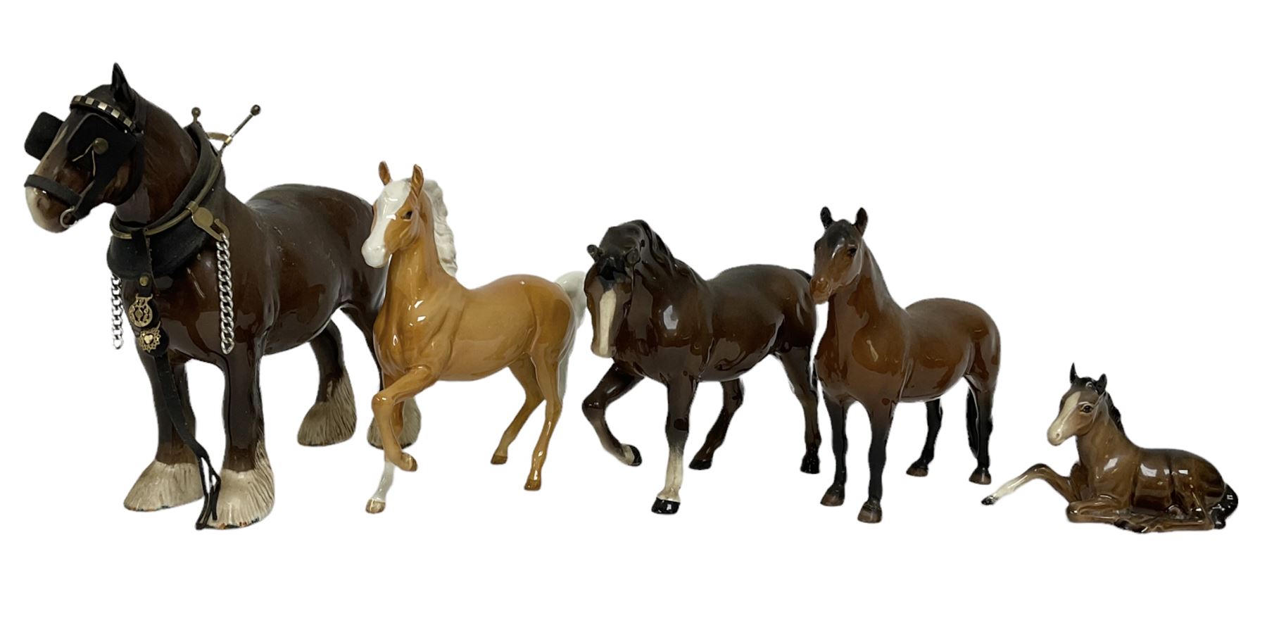 Group of Beswick figures of horses, to include a Palomino horse, Bay Shire horse, recumbent bay foal etc, all with printed marks beneath (5)
