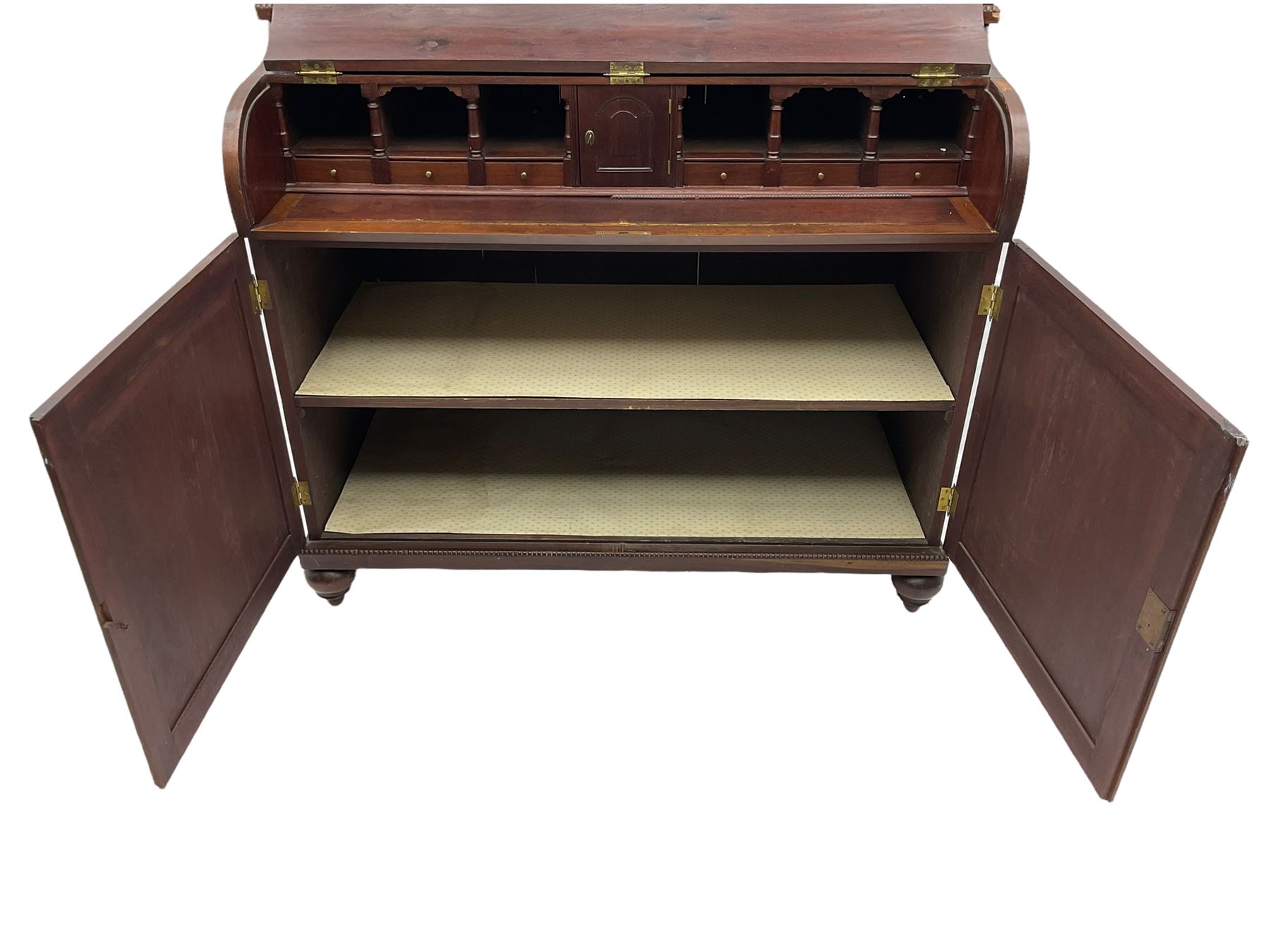 19th century mahogany piano top secretaire bookcase, two astragal doors above curved hinged retractable writing compartment, above two cupboards