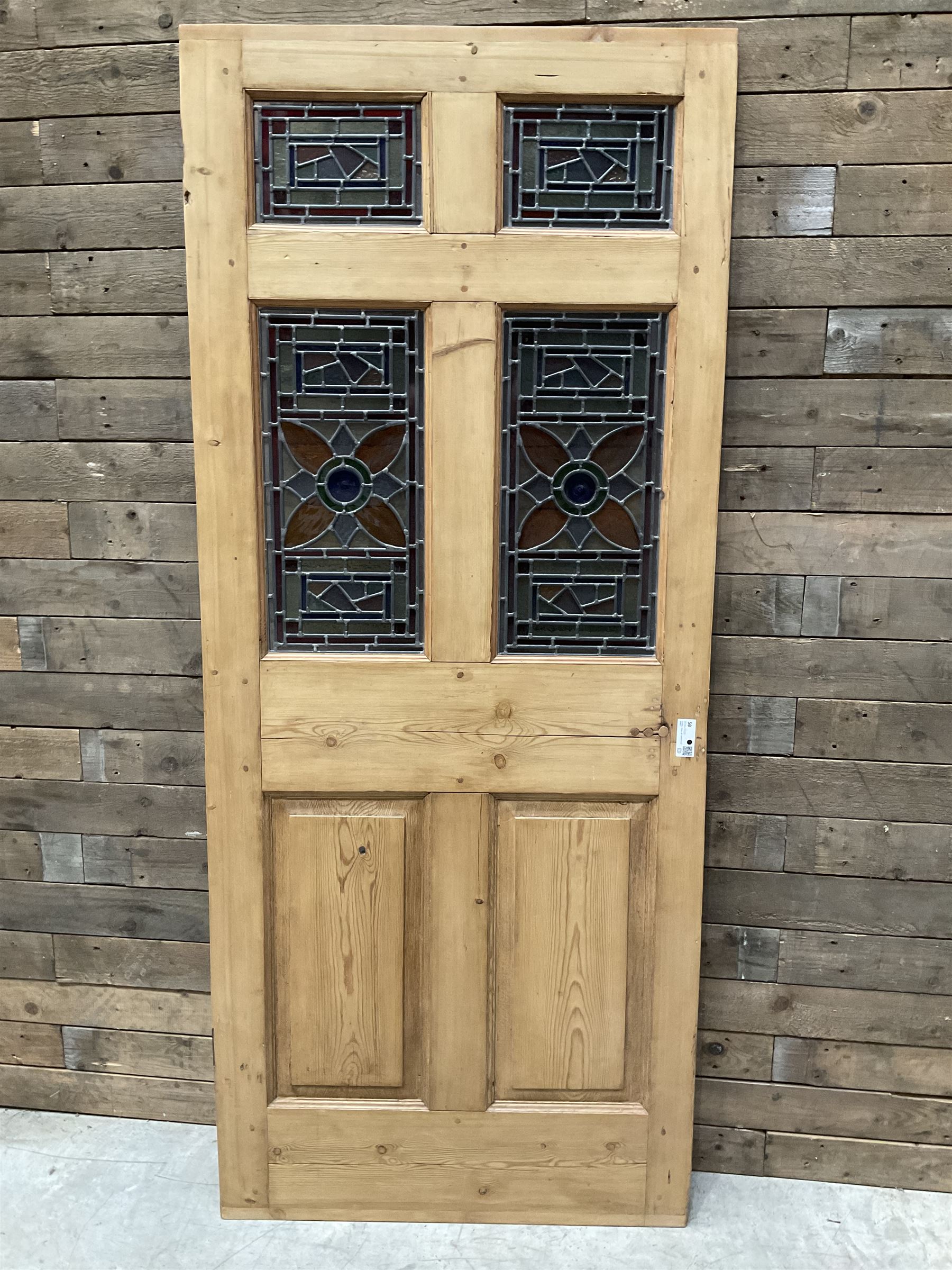 Early 20th century pine six panel door with later stained glass panels