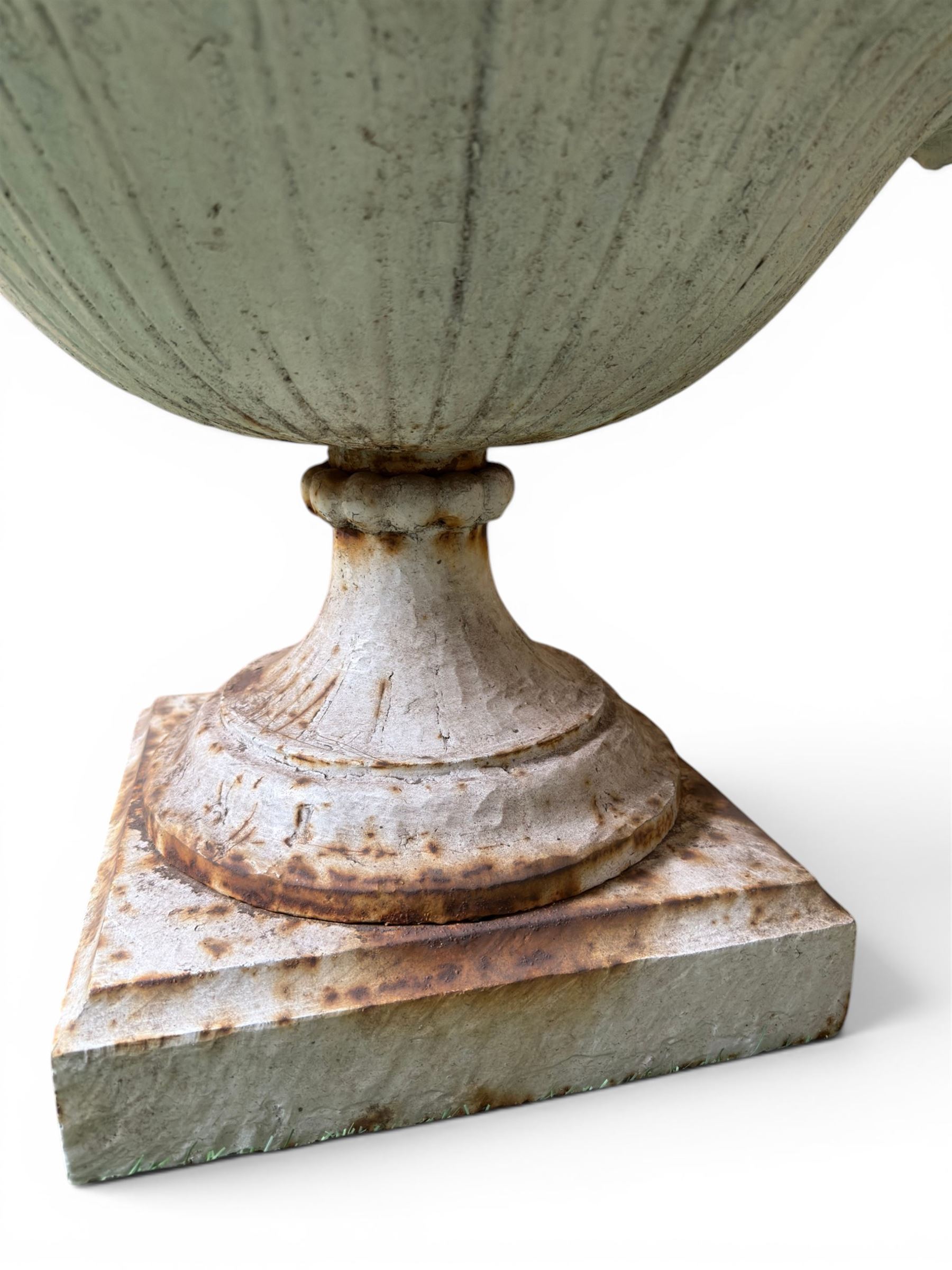 Coalbrookdale - pair of 19th century cast iron petal rim urns, squat form on square plinth, finished in distressed white paint, design registration number 133334, first registered 19 september 1860, number 19 in the Coalbrookdale Castings Catalogue (see illustration)