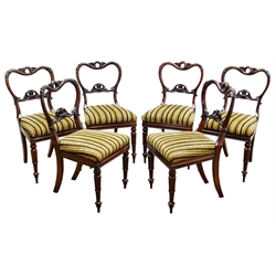  Set six Regency rosewood dining chairs, with kidney shaped moulded pierced and acanthus carved cresting rail and splat with drop in seat on lotus carved turned tapering supports.  Similar design in The Pictorial Dictionary of British 19th Century Furniture Design by Edward Joy, pg. 219   