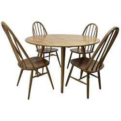 Ercol - elm and beech dining table, oval drop-leaf top on splayed square tapering supports; pair of ercol 'Windsor' elm and beech stick and hoop back dining chairs; pair of mid-20th century dining chairs 