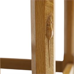 Mouseman - set of three adzed light oak nesting tables, each with rectangular top raised on octagonal legs joined by stretchers, with signature carved mouse, by the workshop of Robert Thompson, Kilburn