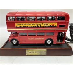 Novelty telephone in the form of a London Routemaster bus, c1997, fitted on wooden plinth with modern connection L25.5cm