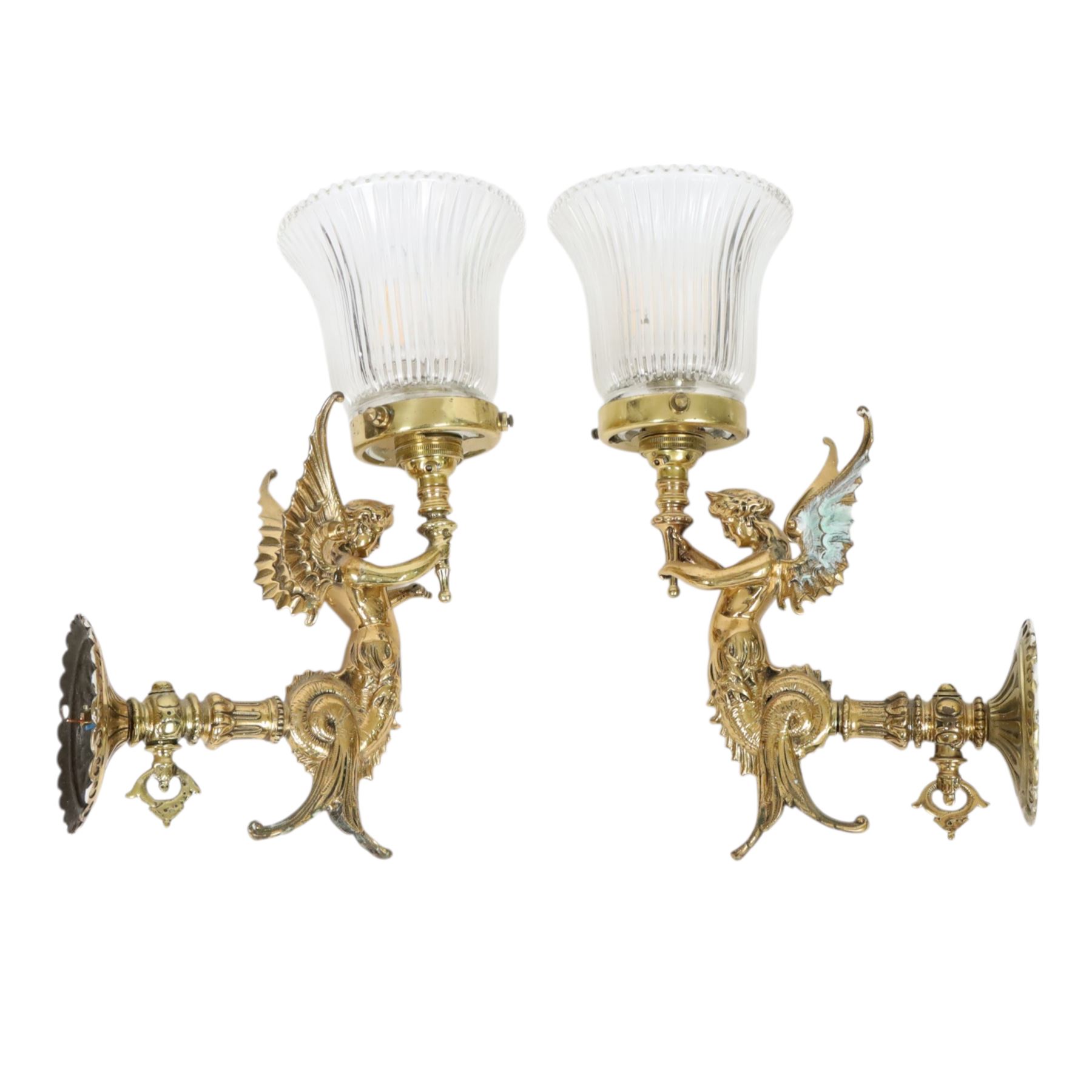 Pair of Victorian style wall sconces, each modelled as a caryatid supporting a single light fitting in one raised arm, with tapering and fluted clear glass shade, approximately H31cm D21cm