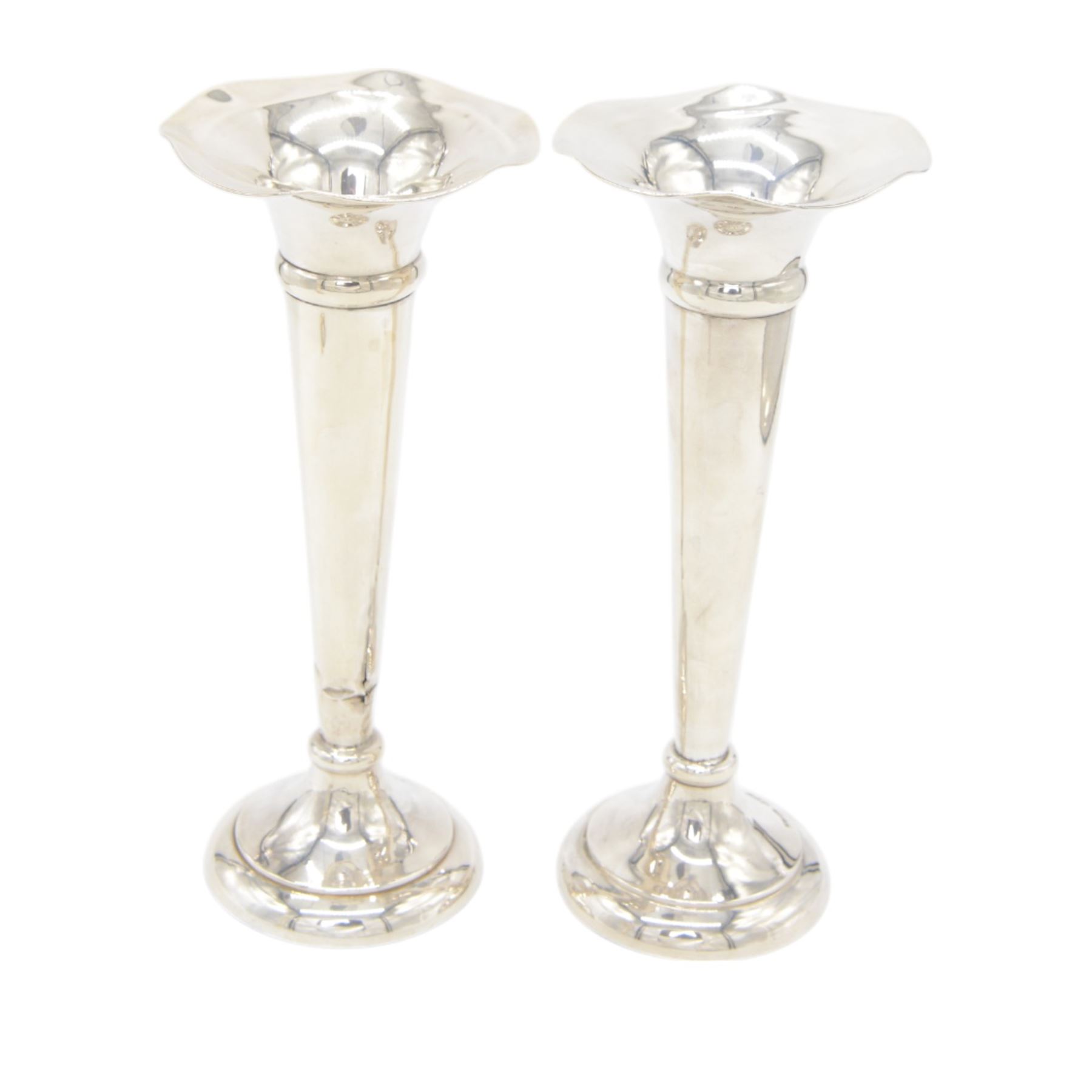 Two pairs of early 20th century silver vases, comprising pair of Edwardian trumpet vases with fluted rims upon a circular domed foot, hallmarked S Blanckensee & Son Ltd, Chester 1907, and a smaller 1920s pair, hallmarked Chester 1920, maker's mark worn and indistinct, tallest H19cm