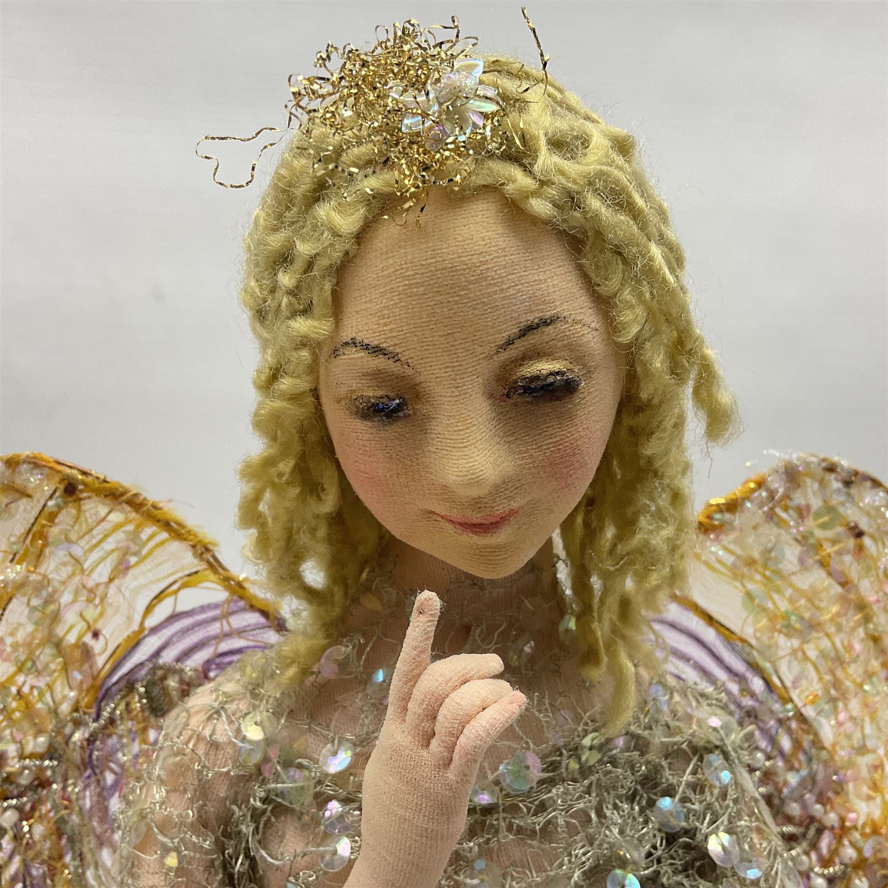 Anna Meszaros Hungary - hand made needlework figurine of an Angel with metallic lace full length dress and open threadwork wings; on moulded base H45cm Auctioneer's Note: Anna Meszaros came to England from her native Hungary in 1959 to marry an English businessman she met while demonstrating her art at the 1958 Brussels Exhibition. Shortly before she left for England she was awarded the title of Folk Artist Master by the Hungarian Government. Anna was a gifted painter of mainly portraits and sculptress before starting to make her figurines which are completely hand made and unique, each with a character and expression of its own. The hands, feet and face are sculptured by layering the material and pulling the features into place with needle and thread. She died in Hull in 1998.