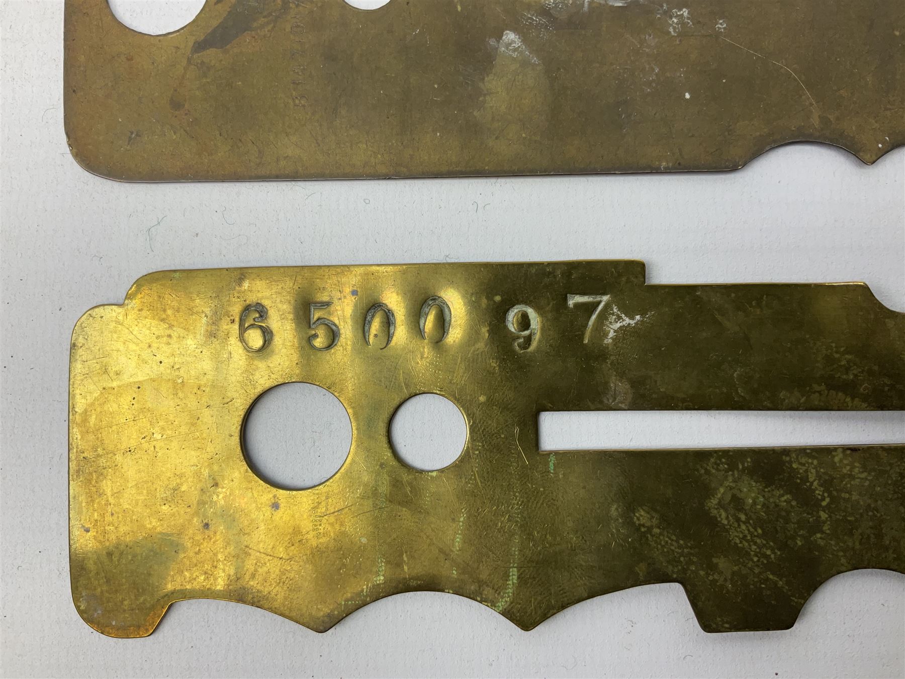 Three war department brass uniform protector button polisher, one marked 650097