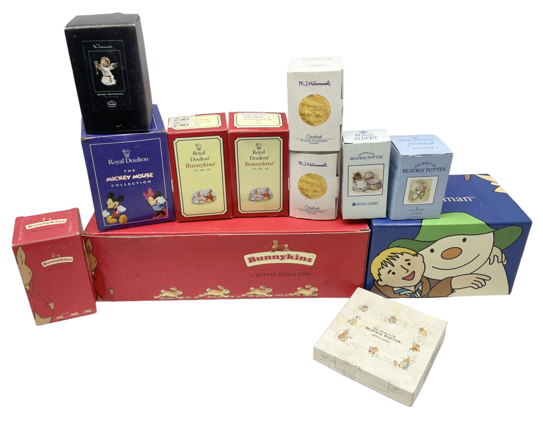 Royal Doulton The Mickey Mouse Collection Pluto figure, Coalport Characters The Snowman Dressing Up figure, three Royal Doulton Bunnykins figures comprising Policeman, Morris Danger and Eskimo, and display stand, Royal Doulton John Beswick Tiggy Winkle, Royal Albert Beatrix Potter Peter Postbag and three Goebel Hummel figures, all boxed