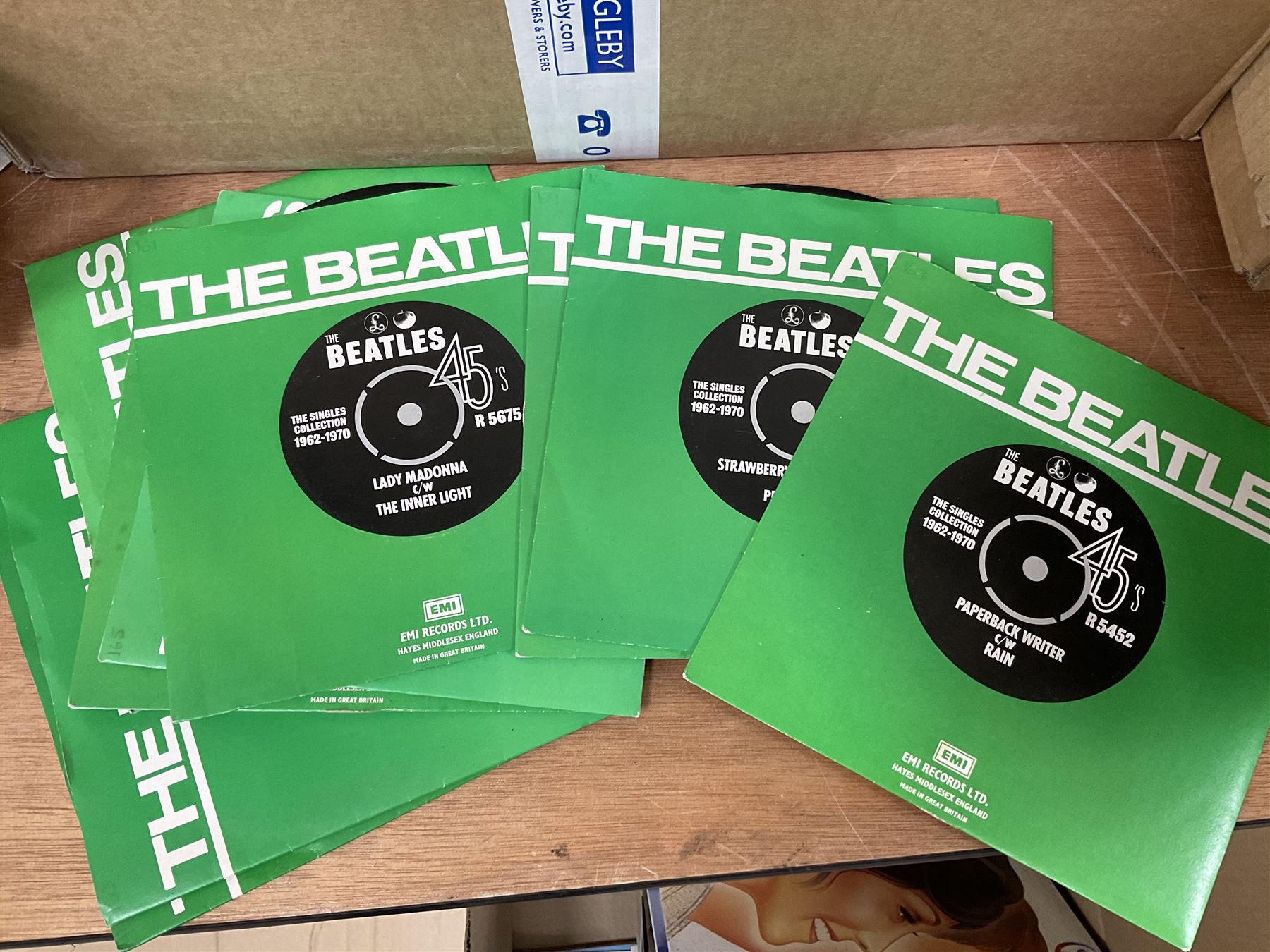 Large quantity of vinyl LPs to include Madonna, ABBA, The Carpenters etc, together with a quantity of 45rpm records, to include approx nine The Beatles The Singles Collection examples etc