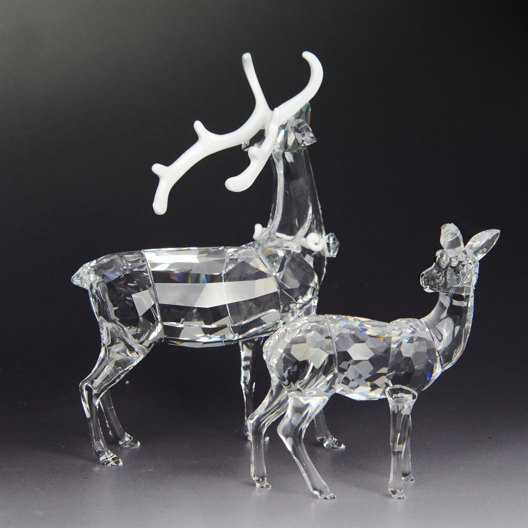 Two Swarovski figures, comprising Doe and Christmas Stag, both in original boxes 