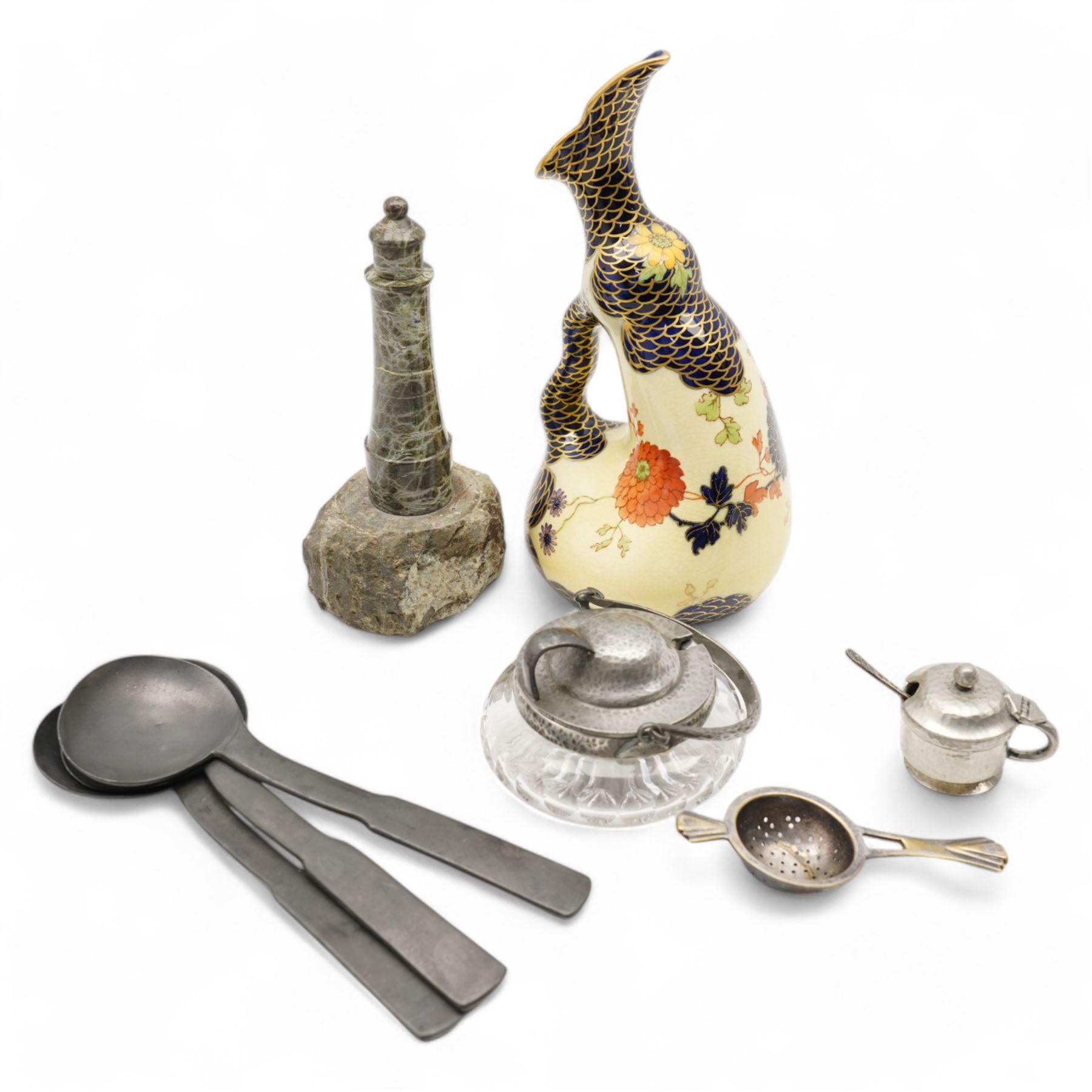 Three 18th century pewter serving spoons, with crown and London touch marks L22.5cm; Liberty & Co. Tudric Pewter sugar bowl; pewter salt and spoon; Cornish serpentine lighthouse; Vienna ceramic jug and Art Deco strainer (8)