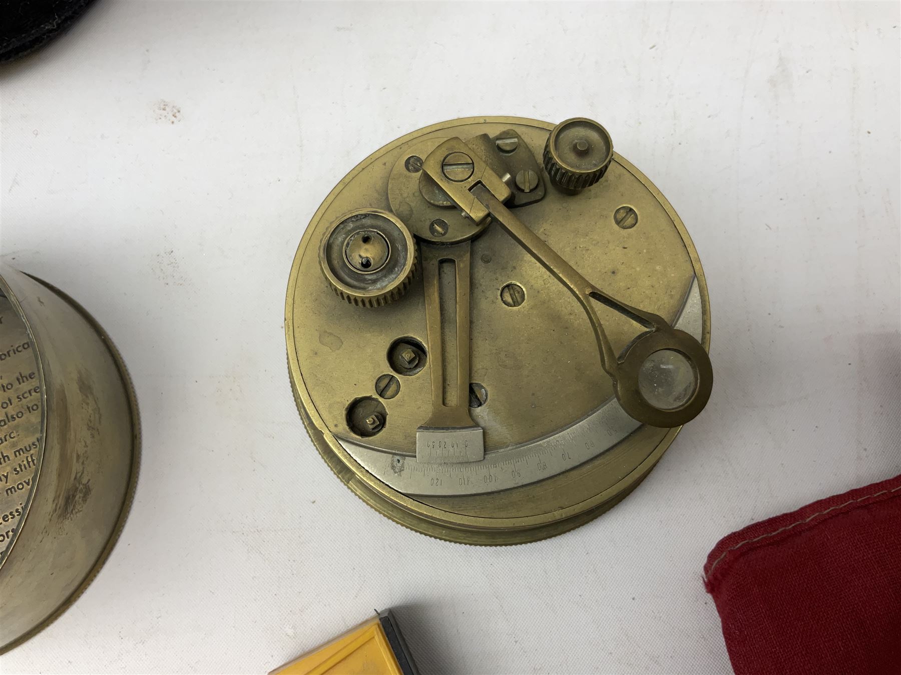 George VI 1937 Coronation flag, the central portrait and date covered with stitched panels 56 x 83cm; sailor's hat; leather holster with belt dated 1943 containing Lone Star toy die-cast Luger gun; and reproduction Stanley brass cased pocket sextant (4)