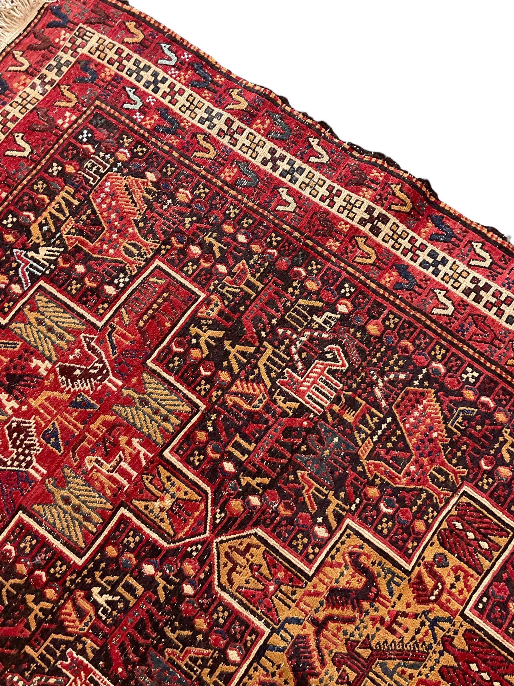 North African flat-woven rug, decorated with small stylised animal and bird motifs, five geometric star medallions