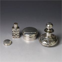 Two early 20th century silver pill/patch boxes, together with two glass perfume bottles wi...