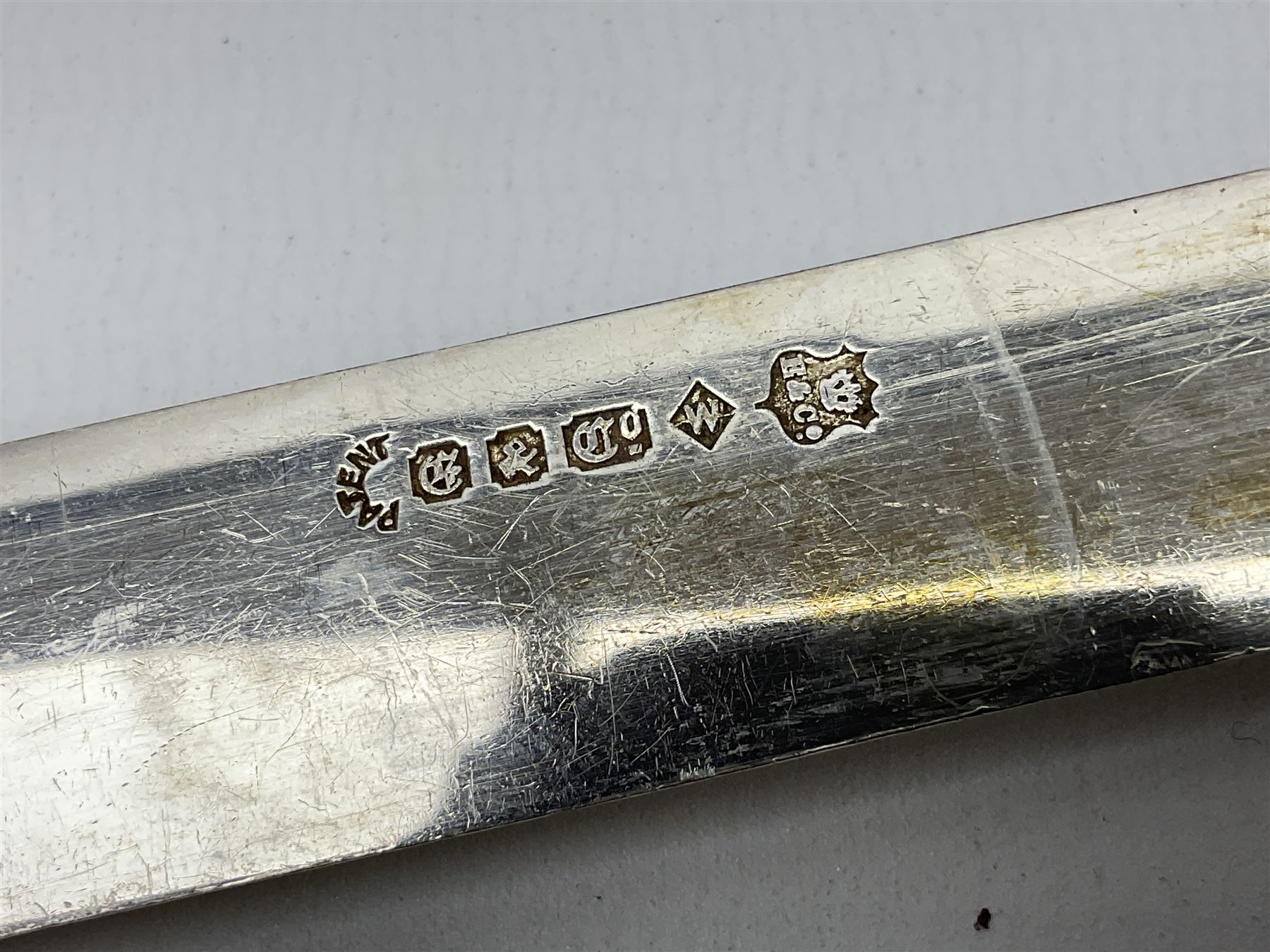 Victorian silver plated dessert set by Elkington & Co for twelve place settings, each reeded handle with vacant cartouche, each with Elkington & Co mark, date letter for 1861, and registration lozenge, contained within a mahogany case with vacant brass cartouche to the hinged cover, opening to reveal a Royal blue baize lined interior with removable tray, case H6cm W29.5cm D26.5cm