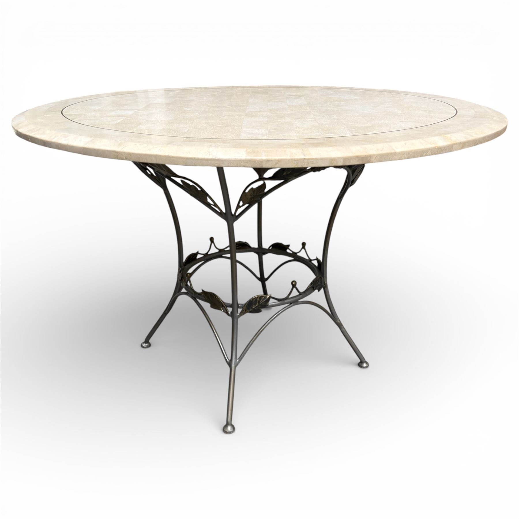 Wrought iron garden dining table with leaf decoration, and set of four matching chairs