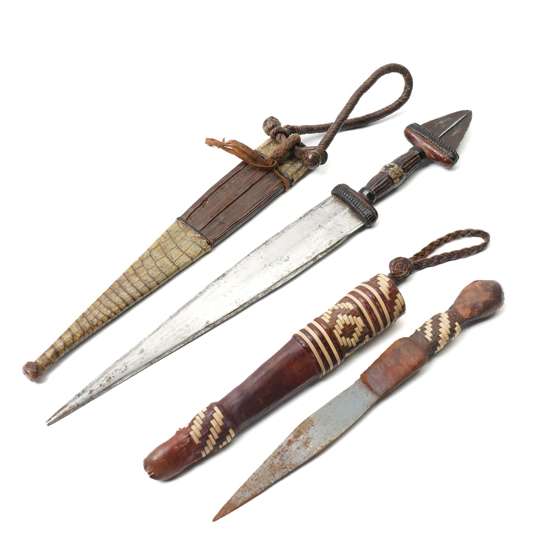 North African arm dagger with leather sheath and one other African dagger (2)