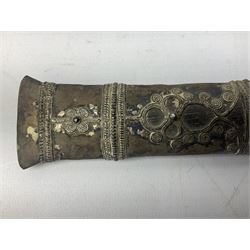 Burmese dha dagger with 15cm steel blade, white metal ferrule and horn handle, in white metal and filigree scabbard L30.5cm; a Burmese long bladed knife with horn handle and brass mounted teak scabbard; and another Eastern dagger in sheath (3)