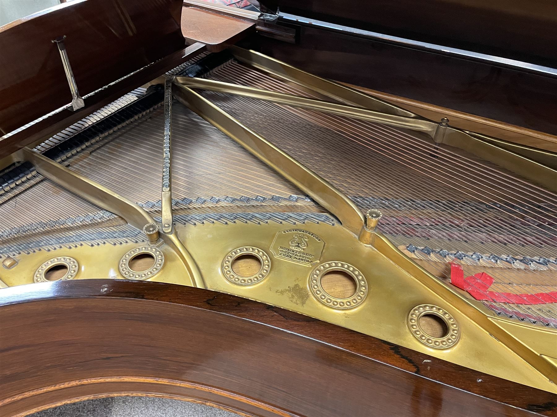 Steinway & Sons – Model B overstrung Drawing Room Grand Piano Serial No 70718 manufactured in Hamburg 1891, with 85 ivory and ebony keys (7 octaves) in a mahogany case with chrome fittings and pedals, Steinway “Fireplug” straight columnar and fluted legs with roller castors and conforming lyre, duplex stringing with agraffs, bass strings copper wound with a steel core, steel tuning pins, original Steinway action, hammers, keys, felts, and dampers, with una-corda, sostenuto and sustain pedals,
Overstrung iron frame detailing numerous Steinway patents, awards, and features. 

This item has been registered for sale under Section 10 of the APHA Ivory Act
