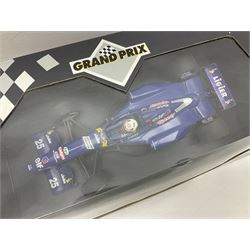 Three Paul's Model Art Grand Prix 1:18 scale die-cast racing cars - Williams Renault FW17 D. Hill; Ferrari 412 T1 J. Alesi; and Ligier Honda JS41 M. Brundle; all boxed (3)