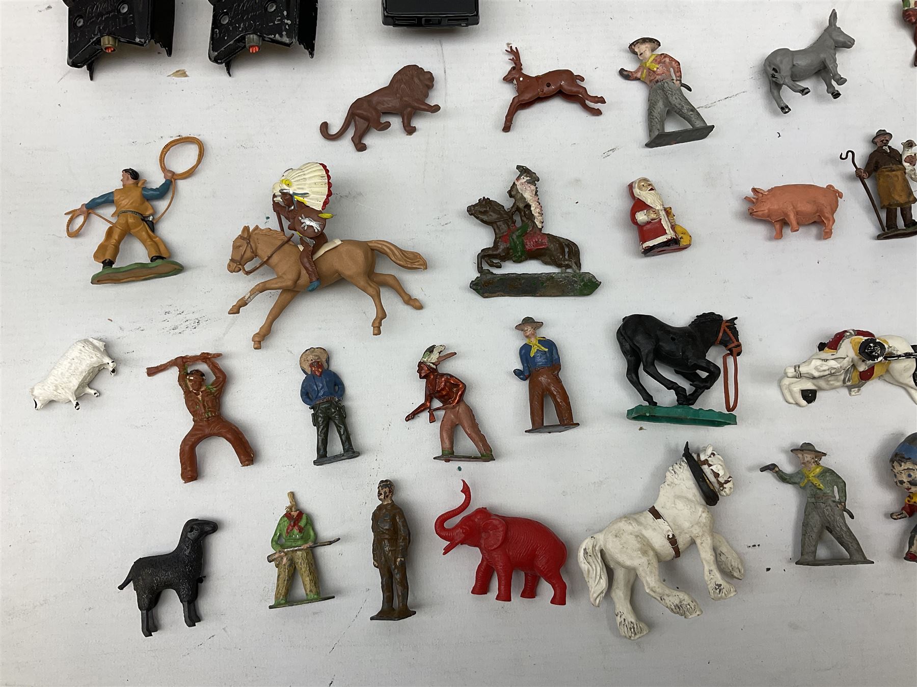 Unboxed and playworn die-cast models of TV/Film interest by Corgi including Green Hornets Black Beauty, two Batmobiles, James Bond Aston Martin DB5, Saints Volvo P1800 etc; two Matchbox 1-75 Series Collector's Cases including various playworn models; and quantity of playworn lead and plastic figures by Britains etc