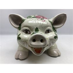 Large ceramic figure of a pig decorated with roses, L45cm