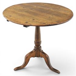 Georgian oak tripod table, plank top with visible dowels with turned baluster column, rais...