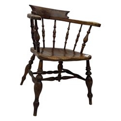 19th century elm and beech smoker's bow armchair, shaped arms over turned spindle gallery and dished seat, on turned supports united by double H-shaped swell turned stretchers 
