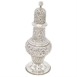 Edwardian silver sugar caster, of typical waisted form profusely embossed with floral and foliate decoration, the removable pierced cover with fluted finial, upon a circular stepped foot, hallmarked William Aitken, Birmingham 1901, H23cm
