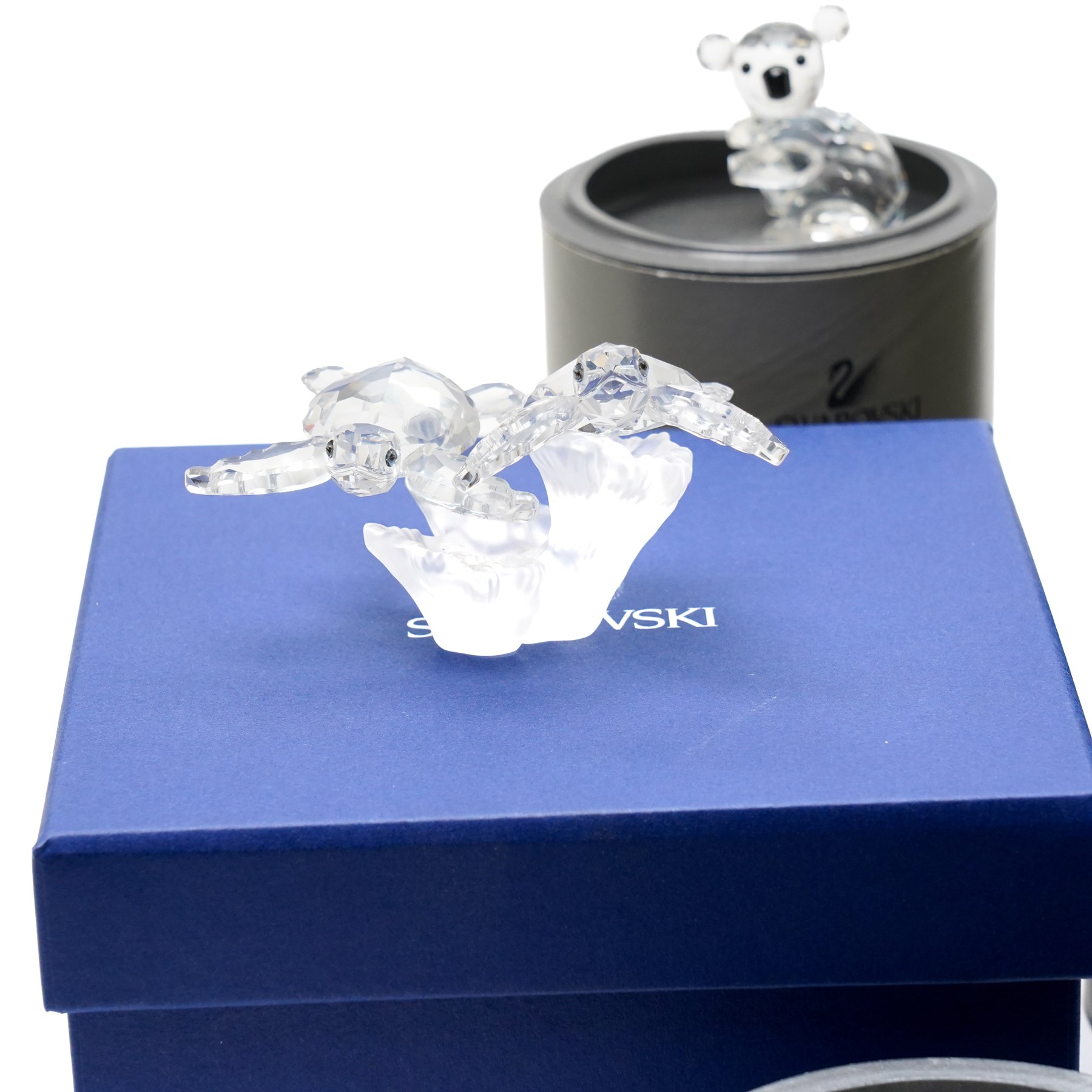 Large collection of Swarovski animal figures, comprising Koala, Polar Bear, Jaguar, mother and baby Seals, two Hedghogs, two Chicks, Fox, Elephant, Dolphin, Turtles, Whale, Rhino and others, all boxed (21)