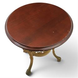 Britannia style cast iron pub table and pair of stools, moulded circular top raised on a gilt painted frame, featuring masks and acanthus detailing united by an under tier, the stools with red floral design (Stools diameter 34cm, height 47cm) 