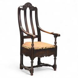 18th century oak provincial armchair, arched and carved cresting rail above triple splat b...