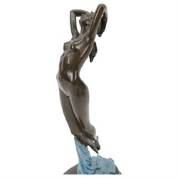 After Joseph Pollet, bronze figure of a nude woman, upon an oval black marble effect plinth, H47cm