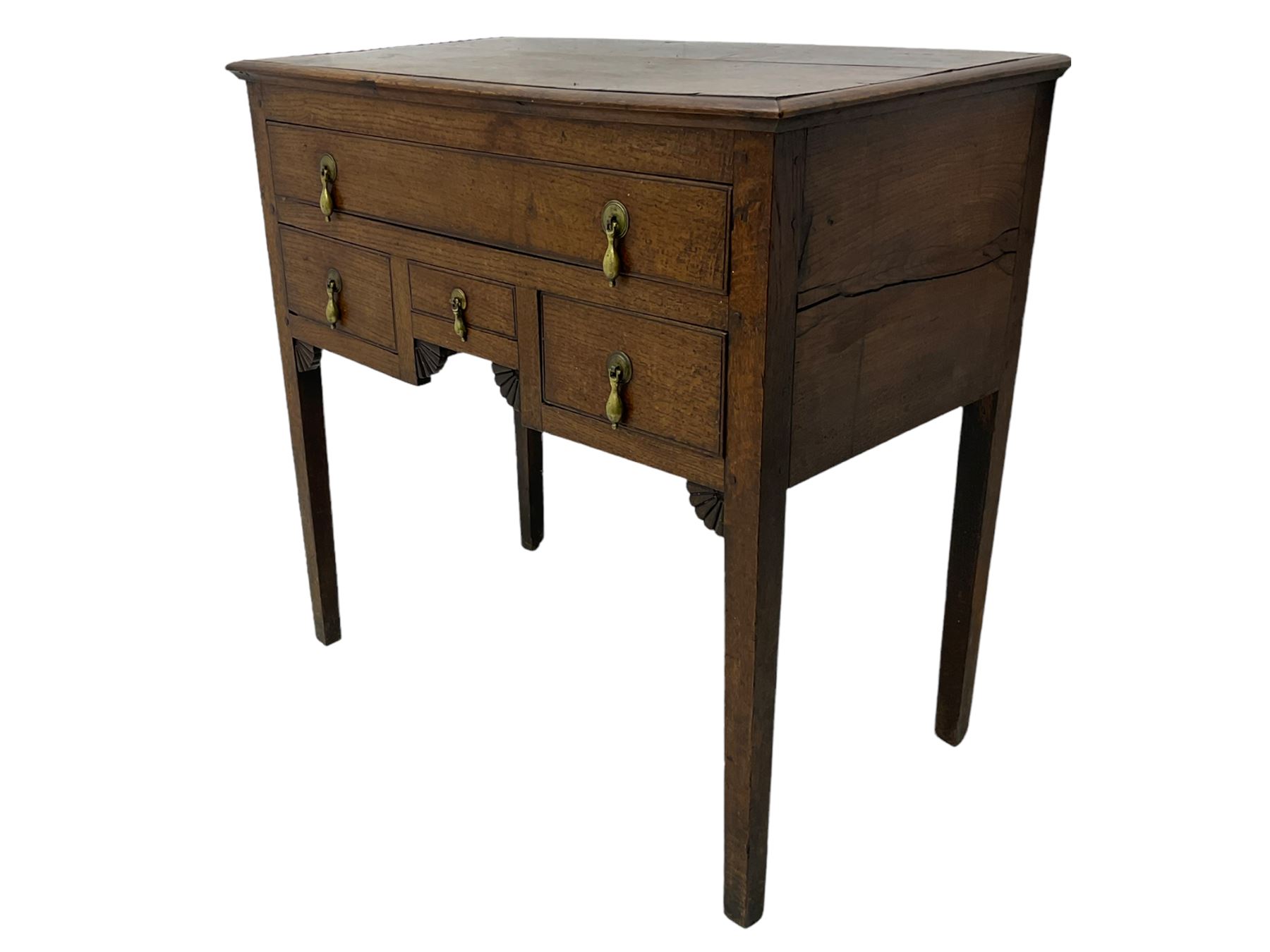 18th century Welsh oak lowboy, fitted with long drawer above three small drawers, square tapering supports, with fan carved corner brackets, circular plate and drop handles 