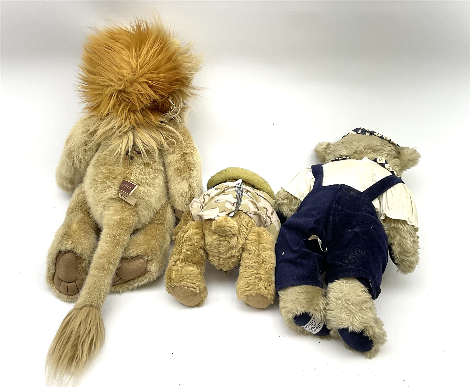 Charlie Bears lion 'Linus', CB141473, with metal key pendant H50cm; Millenium 2000 Collection bear; and another dressed as a British Tank soldier (3)