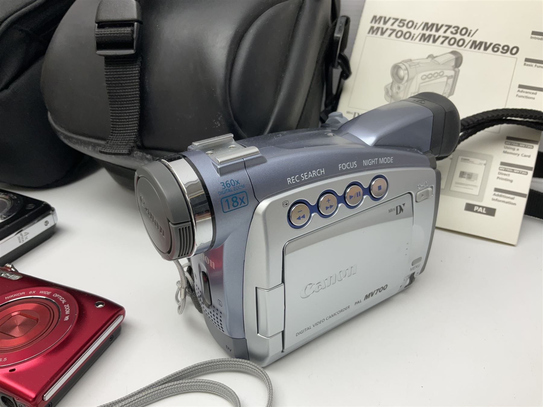 Nikon Coolpix 8700 camera body, serial no 3220838, with Zoom Nikkor Ed 8.9-71.2mm 1:2.8-4.2 lens, together with Canon digital video camcorder and other digital cameras and camera equipment