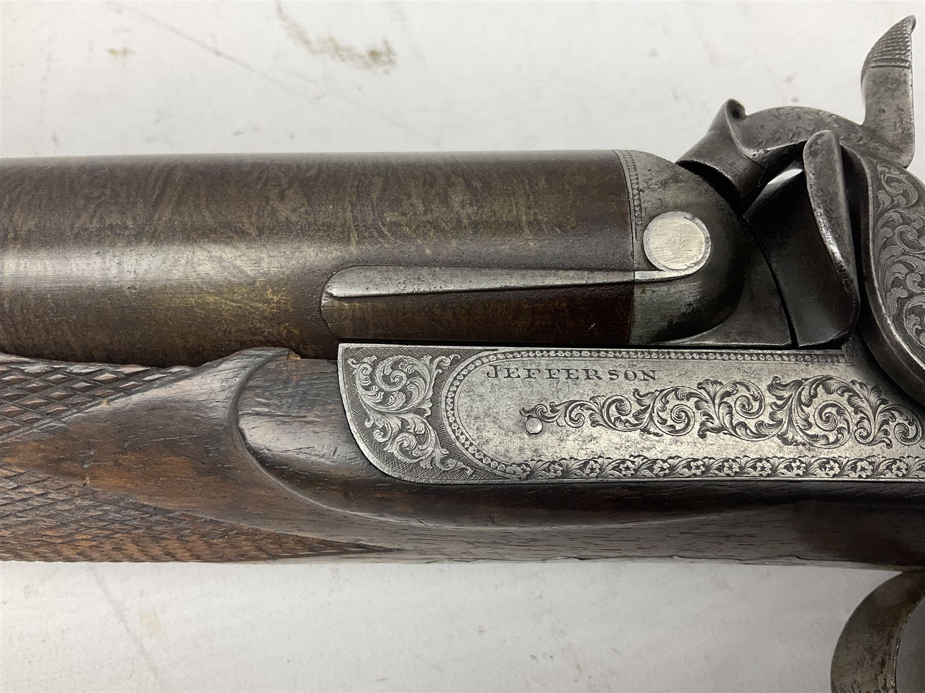 19th century John Jefferson of Scarborough 6-bore (modern 4-bore) double barrel side-by-side percussion gun, with 81cm stub twist damascus barrels (no provision for ramrod), well figured walnut stock with fine chequered grip and fore-end with horn tip and steel butt plate with long tang, well engraved lock and hammers with half-cock safeties on both sides, barrel sling swivel but rear sling swivel removed and replaced with silver escutcheon, London proofmarks, NVN, L128cm