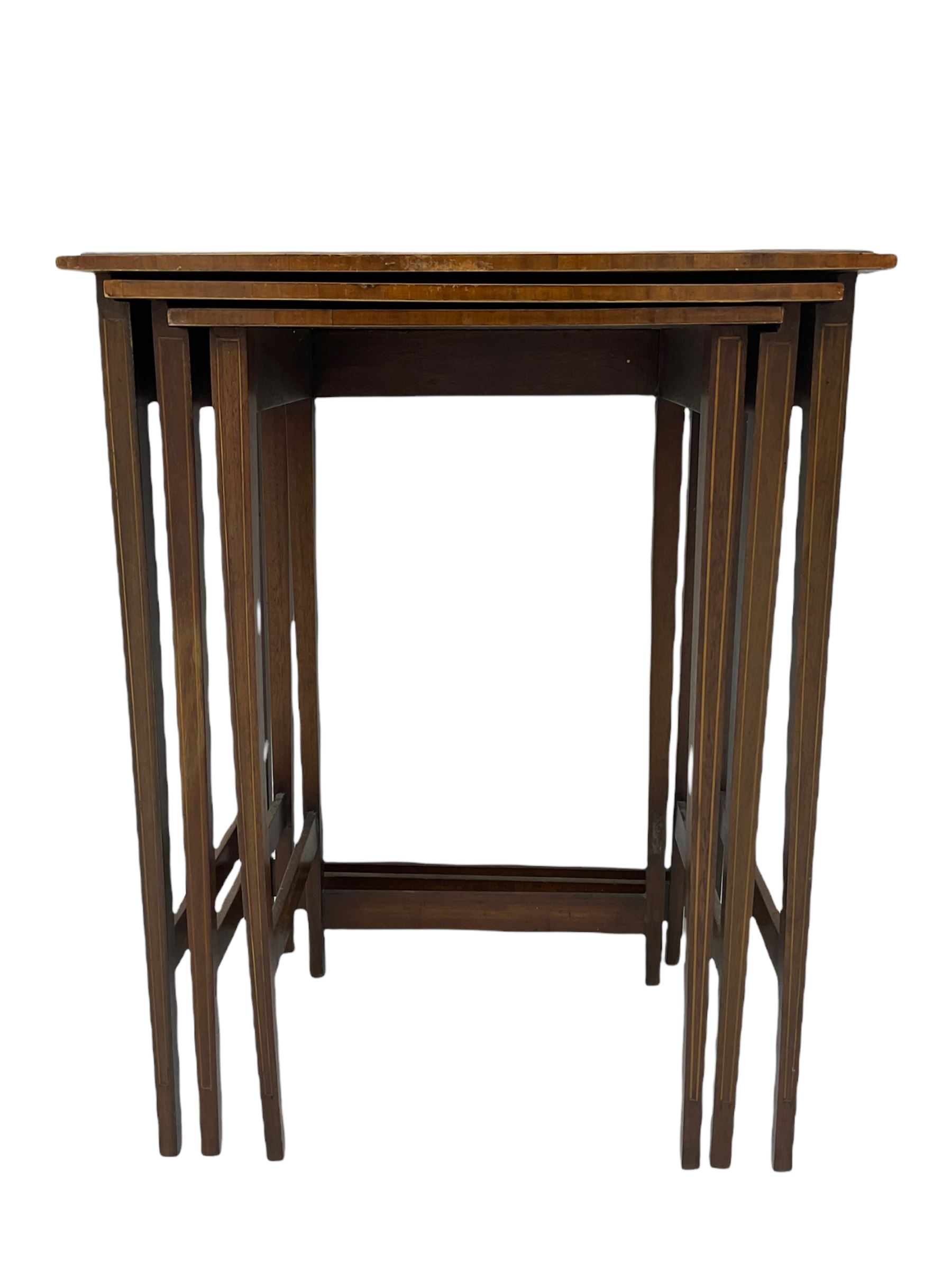 Edwardian mahogany wall hanging corner display cabinet, projecting dentil cornice over astragal glazed door (W56cm, H93cm), and an Edwardian mahogany nest of three tables (46cm x 36cm, H60cm)