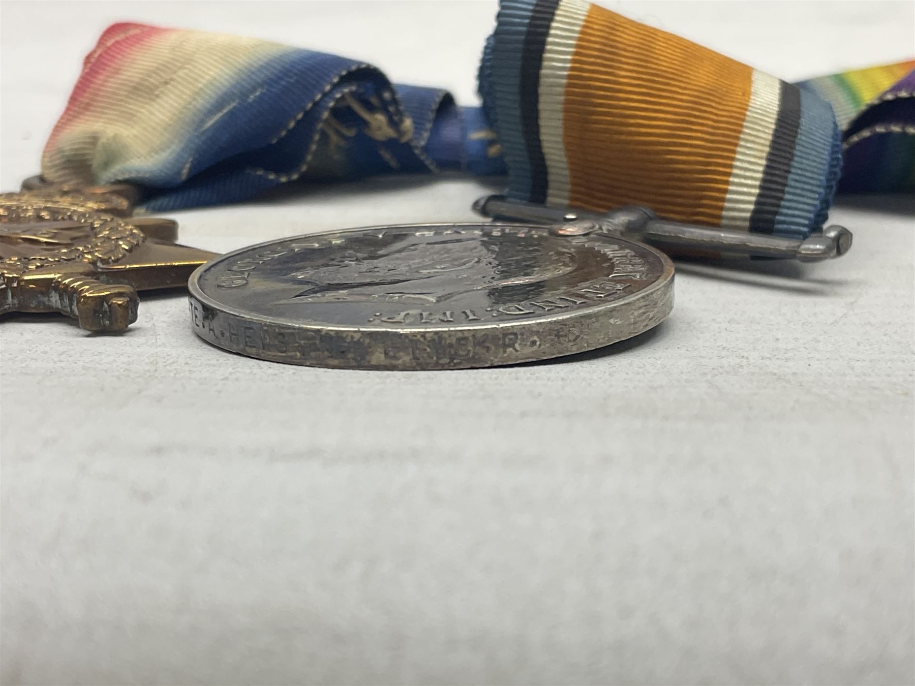 WW1 group of three medals comprising British War Medal, 1914-15 Star and Victory Medal awarded to 8110 Pte. A. Hewson Linc. R.; with ribbons