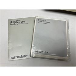 Four 1970s Sinclair electronic calculators - Cambridge in hard case with booklet; Scientific Programmable with Program Library and booklet; Scientific in hard case; and Oxford 300 in soft case with booklet; together with Texas PC-100 SR56 programmable slide-rule calculator on base station with readout, two booklets, keys and cover, serial no.9103093