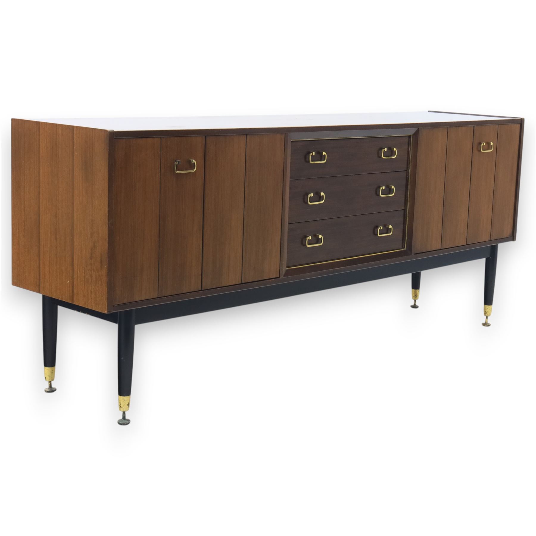 G Plan - ‘Librenza’ tola wood sideboard, the rectangular top above two cupboards to either side and three graduated central drawers, the drawer and door fronts veneered in figured tola wood with brass handles, standing on splayed tapering legs