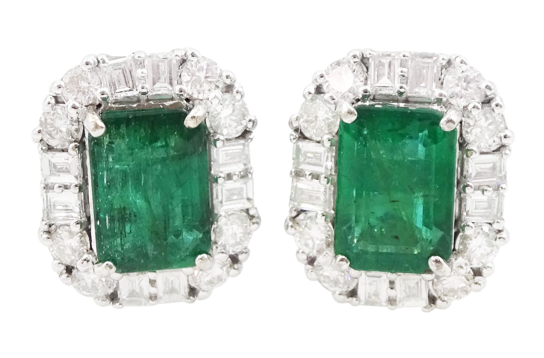 Pair of 18ct white gold emerald and diamond cluster stud earrings, octagonal cut emeralds, with round brilliant cut and baguette cut diamond surround, total emerald weight approx 2.30 carat, total diamond weight approx 0.70 carat